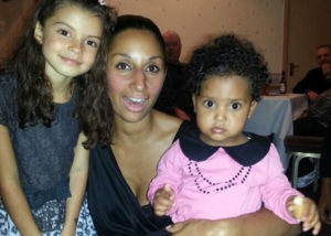 a smiling Antoinette Irving with 2 of her children