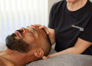 one of our practitioners treating a relaxed patient
